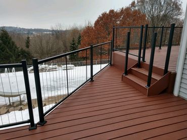 Removed and replaced cedar deck boards and replaced with Ultradeck and aluminum railing sections. 