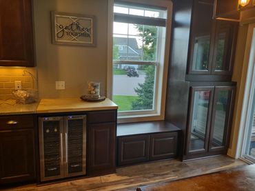 Cherry built in cabinets to match existing kitchen cabinets. Butcher block top with window seat. 