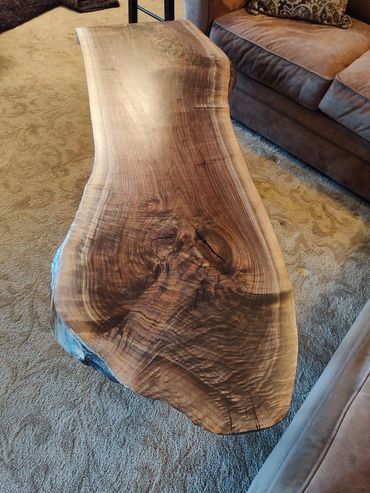 Walnut live edge coffee table with matching end table.  Sturdy steel legs. Satin finish.  