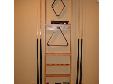 Custom pool cue rack. Holds 8 cues, 2 racks , brushes, and places for 15 pool balls. 