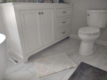 Bathroom vanity with flush mounted doors and drawers. Soft close hardware. 