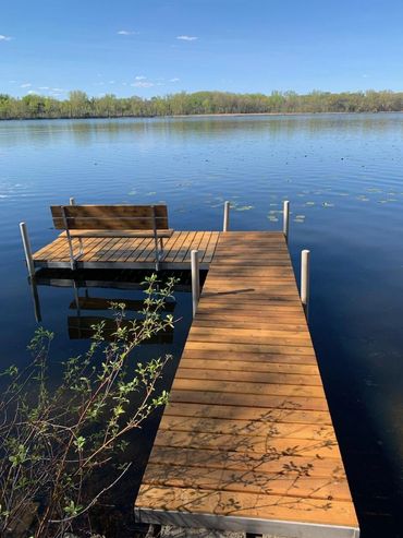 Rebuilt 6 cedar deck sections of a dock including bench. Used Outlast Log Oil Q8 to finish and seal