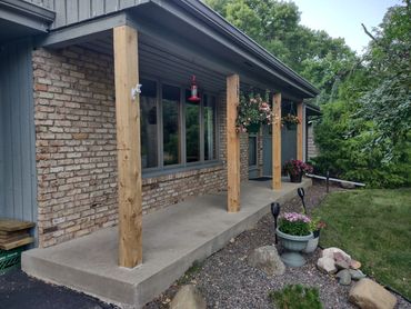 Removed and replaced front cedar 6" x 6" cedar posts on front porch. 