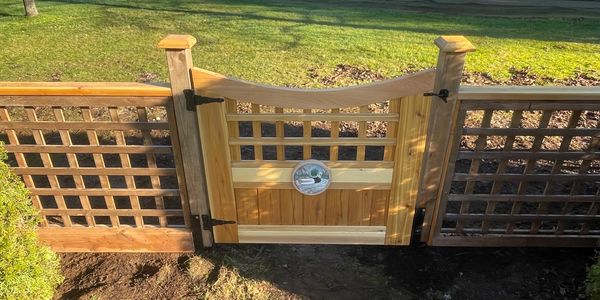 Custom gate on a privacy fence overlooking Crown Isle golf course 