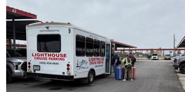 Shuttle bus at cruise parking with passengers and luggage.