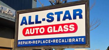 Sign for All-Star Auto Glass with services listed.