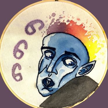 Blue-faced person with fiery hair and number 666.