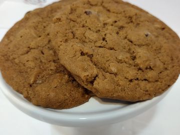 Chocolate Oatmeal coconut cookies on a white plate.