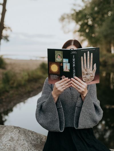 a therapist reading a book about symbols 