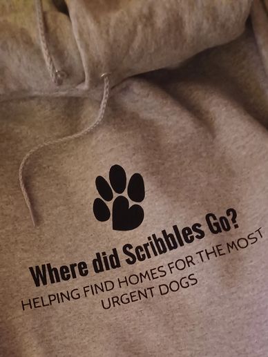 Hoodie with a dog paw print and rescue message for urgent dogs.