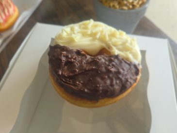 Half-chocolate, half-vanilla frosted donut.