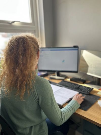 Coach working at desk