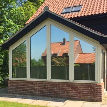 house with reflective window film