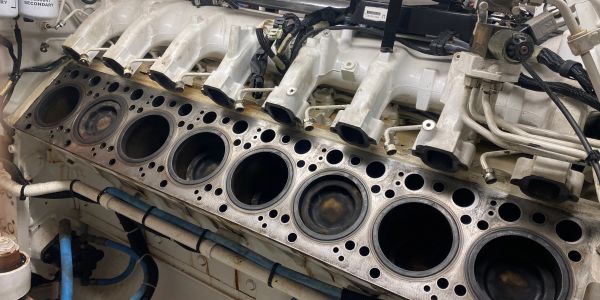 Close-up of a disassembled engine block with cylinder bores.