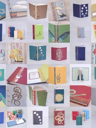 A collage of various handmade notebooks with unique covers and designs.