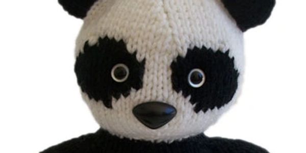 Close up of stuffed panda face