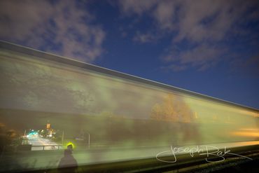 Surreal photo of Downtown Bryon Ohio through a train in motion.