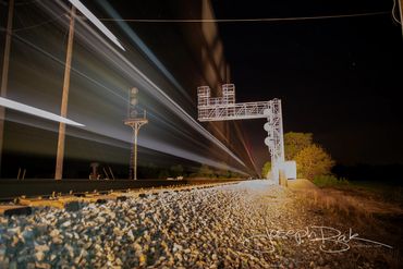 Surreal Train in Motion alive with electricity in Bryon, Ohio.