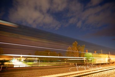 Surreal Train in Motion alive with electricity in Bryon, Ohio.