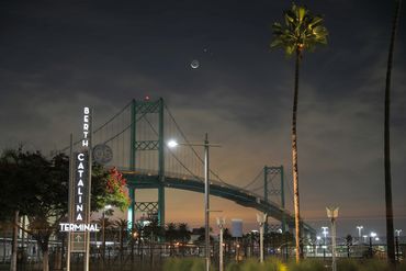 San Pedro, California. Amazing photo of the Vincent Thomas Bridge with a bright crescent moon above.
