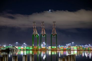San Pedro, California. Incredible photo of Ship to Shore cranes with a bright crescent moon above.