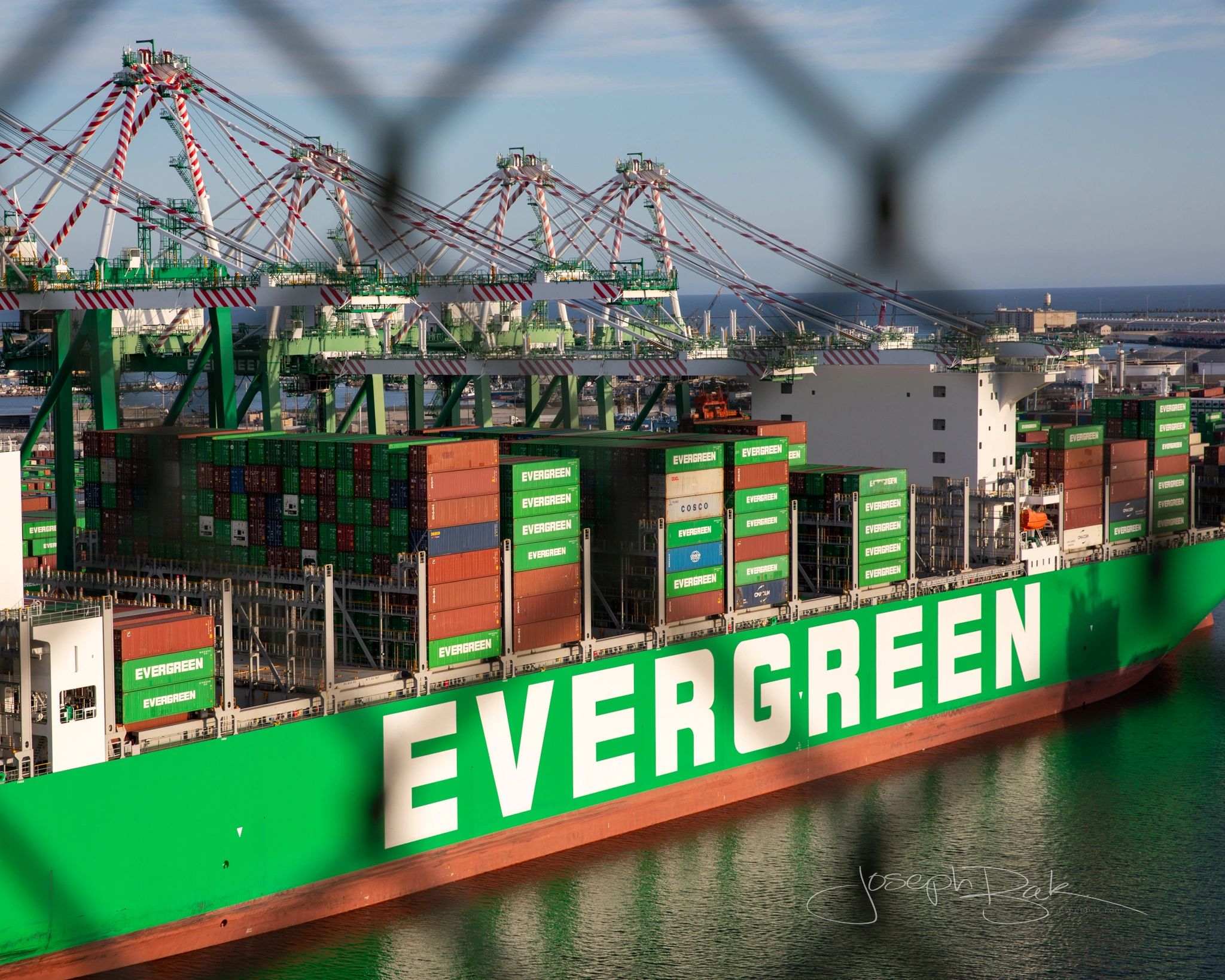 Never before photo from the top of the Vincent Thomas looking  at Evergreen Shipping through fence.