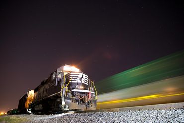 Train Engine 5343 and a passer by under a star filled, Bryon Ohio sky.