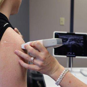 Ultrasound being performed on a person's shoulder.