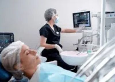 Dentist checking patient's dental images.