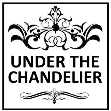 Elegant logo with decorative floral design and text 'UNDER THE CHANDELIER'.