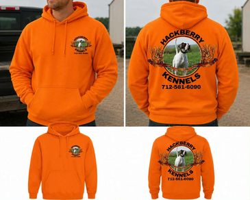 Bright orange hoodies advertising Hackberry Kennels with dog image.