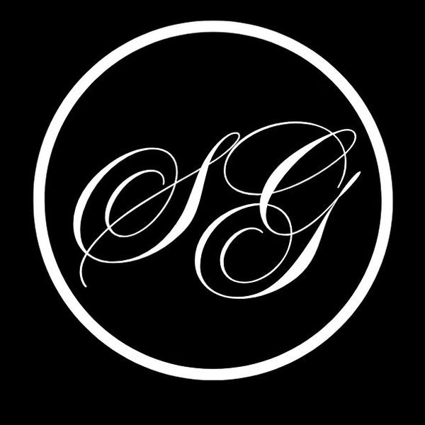 Elegant white SG initials inside a white circle on a black background.