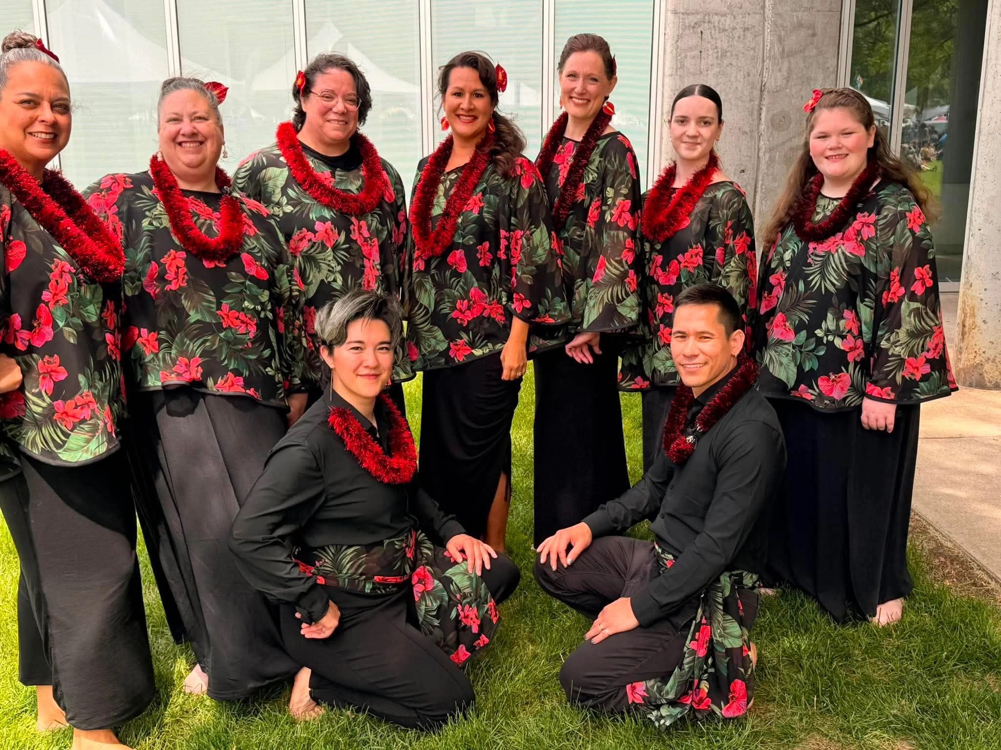 Photo of Aloha Wind members wearing red and black. 
