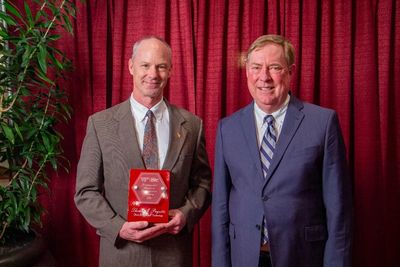 Tom Payette (left) receives the Ut Prosim award from Dr. Joe Marcy, Head of Food Science Technology.