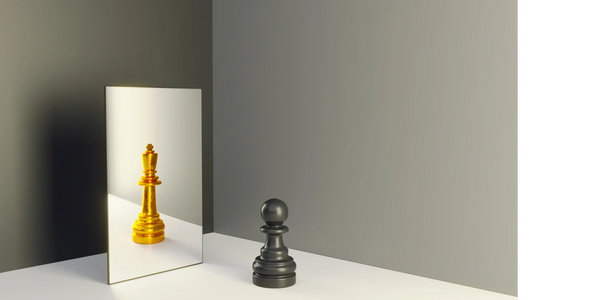A black pawn sees its reflection as a golden king in a mirror.