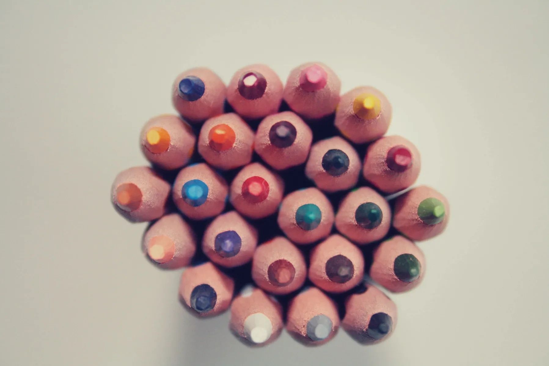 Top view of colorful sharpened colored pencils.