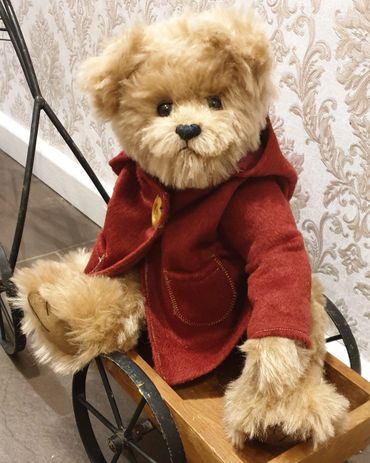 This is biscuit, made of alpaca and sporting his handmade duffle coat. 