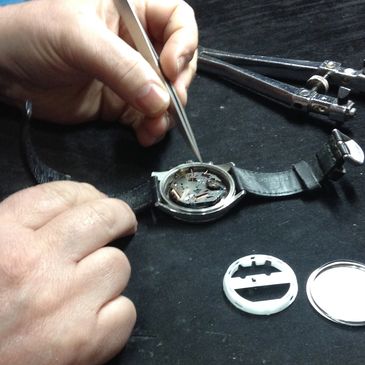 a watch being repaired