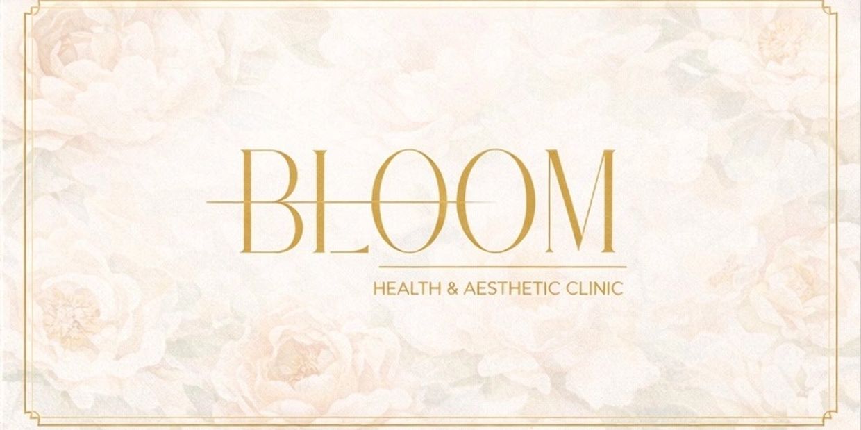 Bloom Health &amp; Aesthetic Clinic logo with elegant floral background.