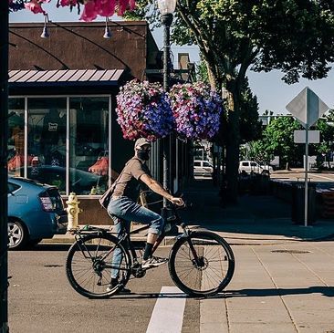 Kevin Teater riding his bike along 1st Street