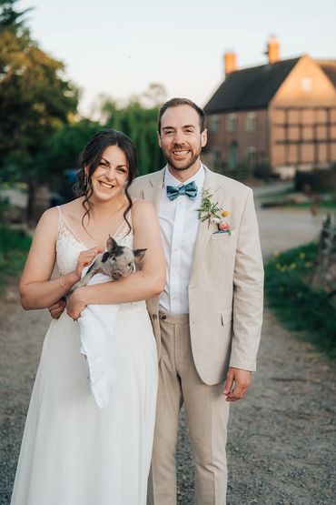 Bride and Groom with the piglet