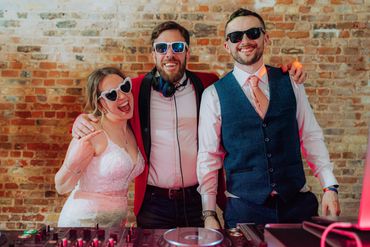 DJ with bride and groom