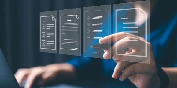 Person interacting with digital document icons using a stylus.