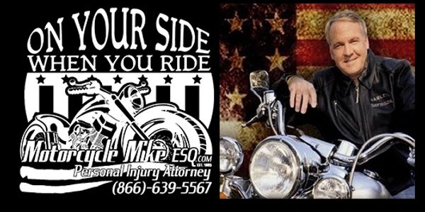 Man sitting on a motorcycle with a USA flag in the background