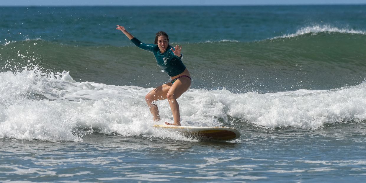 Adriana Molina surfing a wave in Nosara Costa Rica in 2017