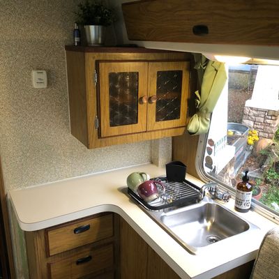 Balboa Motorhome kitchen galley image with double sink and storage cabinet