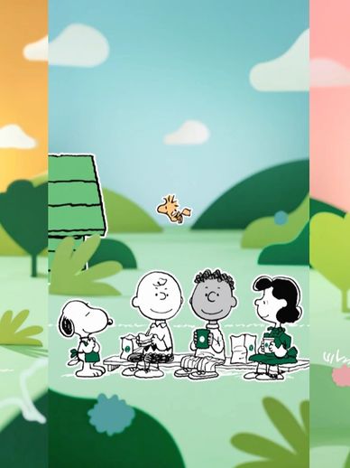 Peanuts characters enjoying a picnic outdoors with Snoopy, Charlie Brown, Franklin, Lucy, and Woodstock.