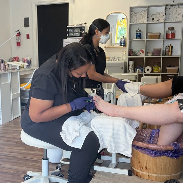 Woman getting a pedicure at a salon.