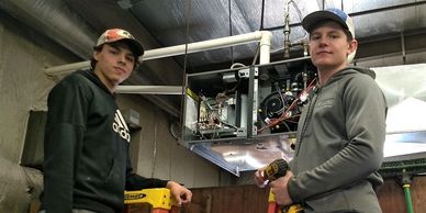 Heating technician changing furnace in Neillsville