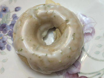 key lime coconut donut on a plate